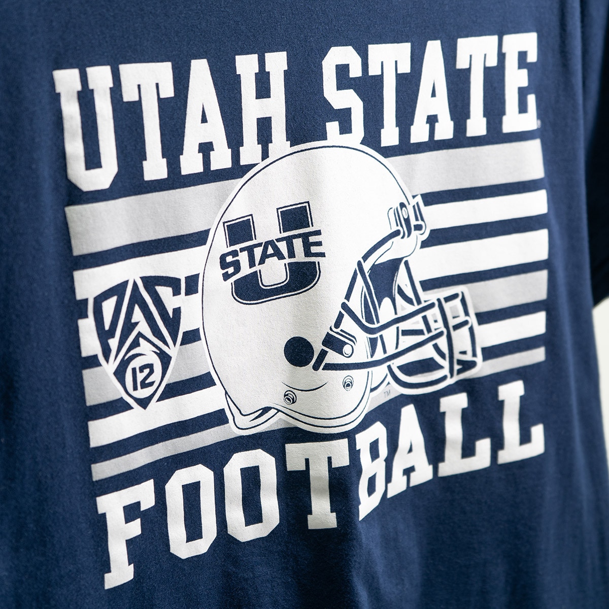 close up of navy utah state football helmet pac-12 t-shirt